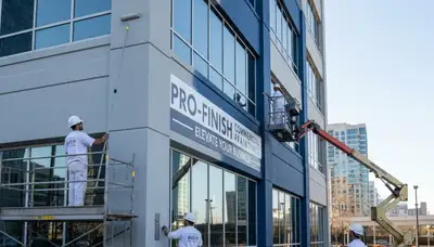 Professional commercial painters coating office exterior in Lynchburg, VA